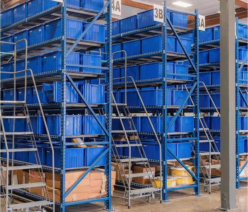 Rows of labelled parts bins on warehouse racking, spanning the full catalog
