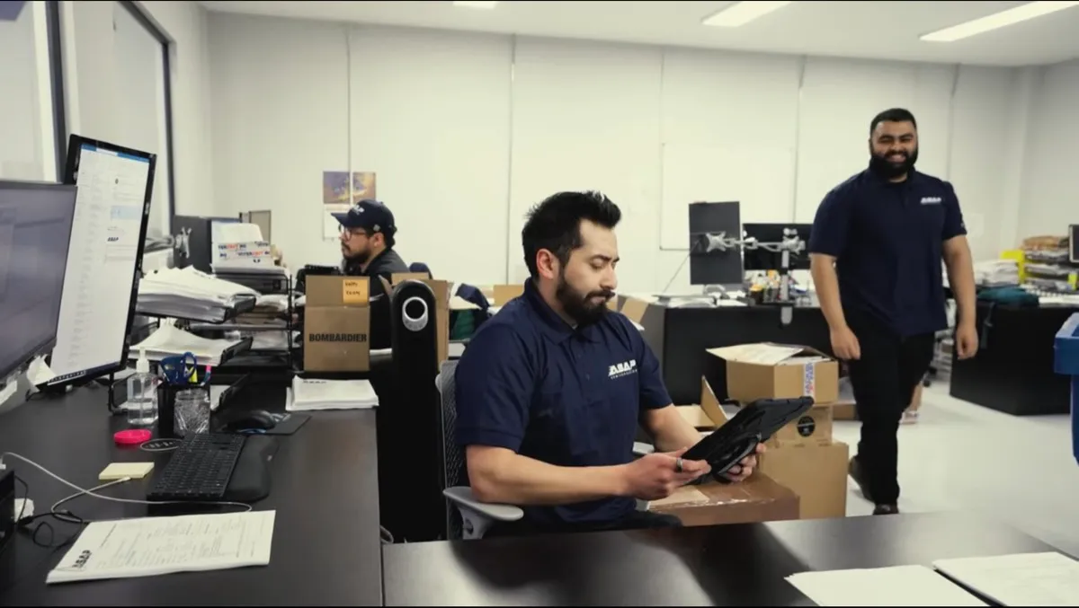 ASAP team member reviewing a part request at their desk