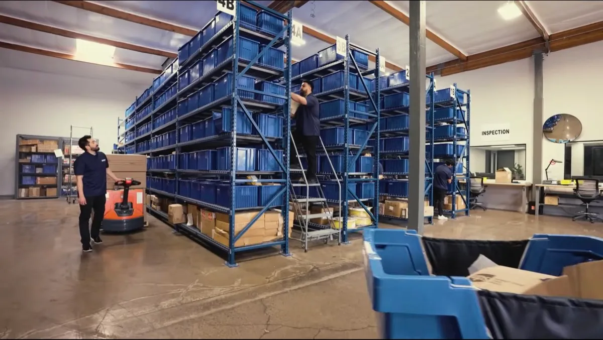 Numbered and lettered storage bins organizing inventory by classification